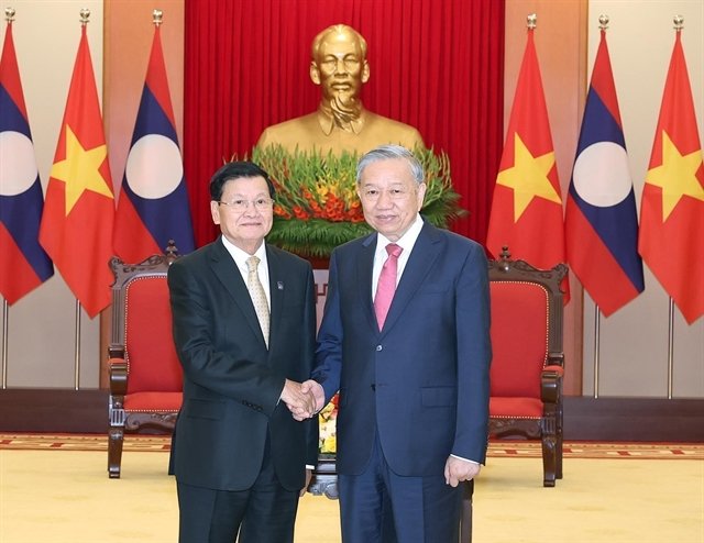 459614_5306415655868840_vna_potal_party_chief_meets_with_lao_top_leader_8362327